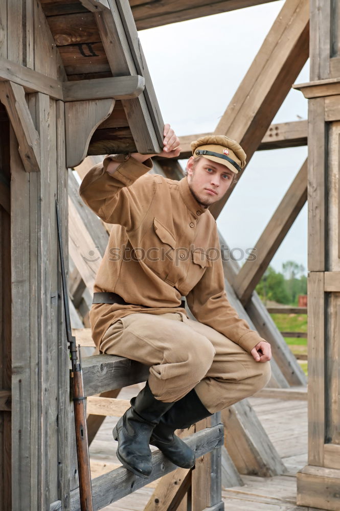 Similar – Image, Stock Photo Portrait of a young male adjusting the saddle on his horse