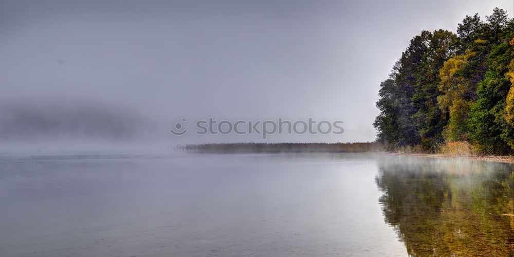 Similar – Rain clouds and their reflection