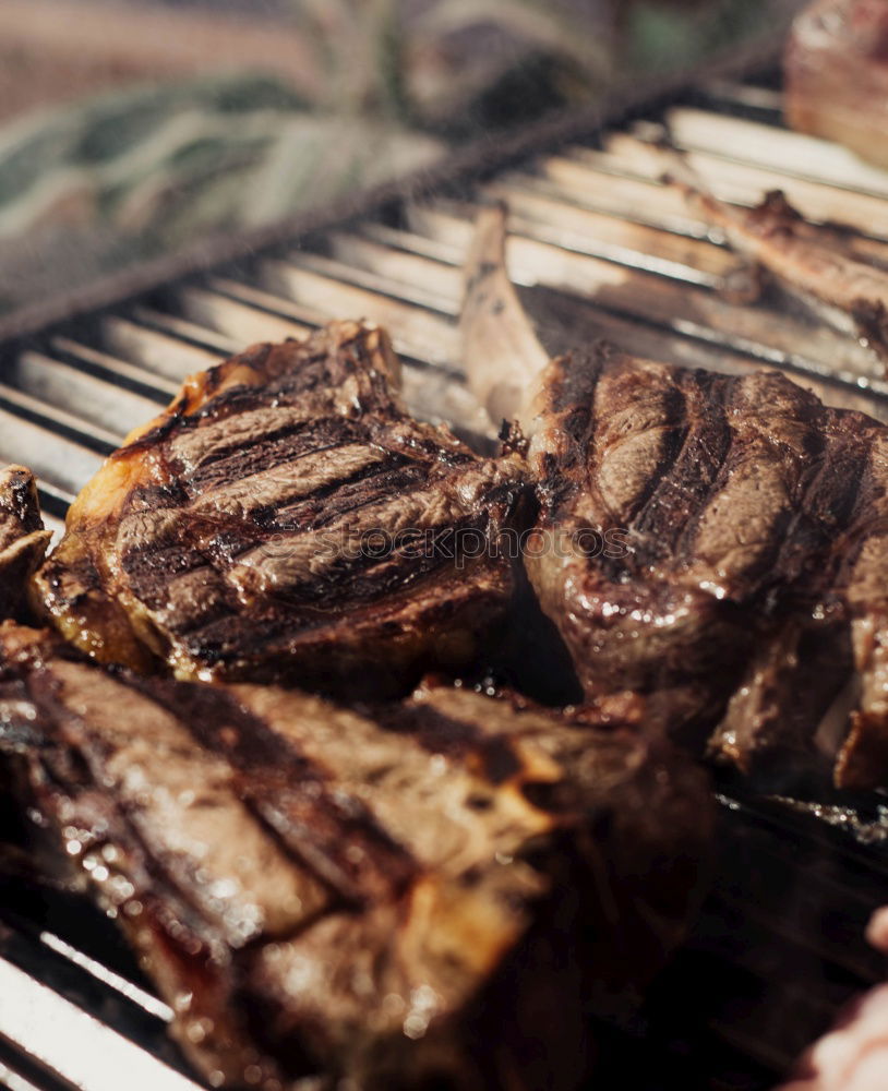 Similar – Image, Stock Photo Juicy steaks on the charcoal grill