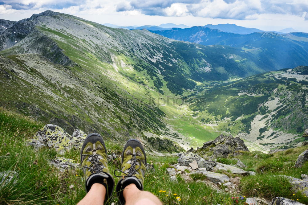 Similar – 2 people hiking show their hiking boots