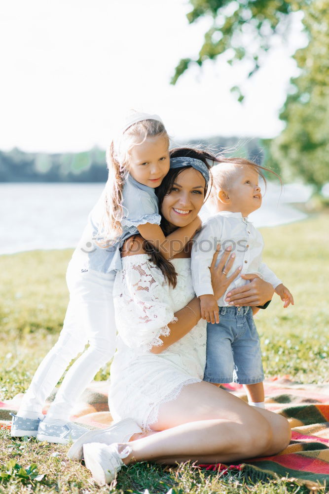 Similar – Image, Stock Photo Young adult mom giving toddler kiss on cheek