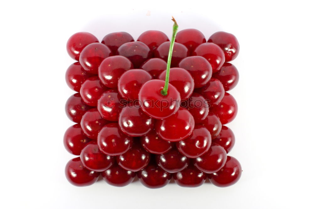 Similar – freshly picked red currants lie in a glass bowl on a red and white chequered tablecloth