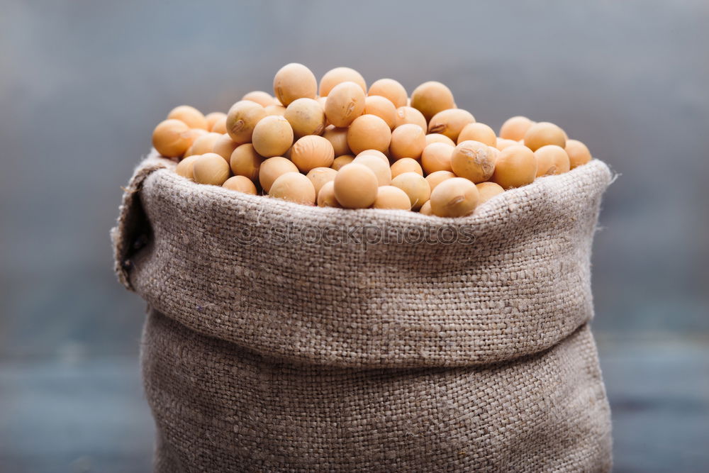 Similar – Soy beans in a sack on wooden table