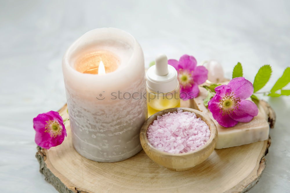 Similar – Spa Massage Zubehör mit Handtüchern, Steinen und Blüten