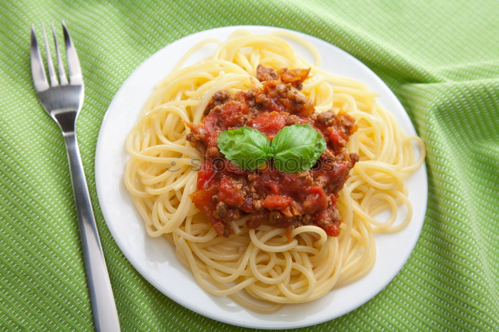 Similar – Spaghetti Bolognese in plate with fork