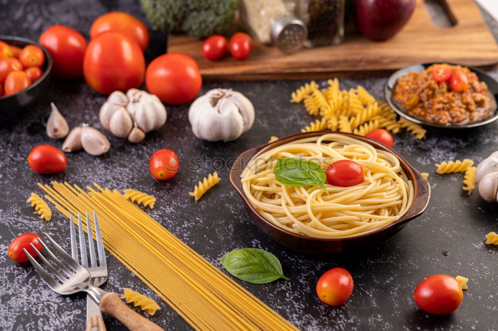 Similar – Image, Stock Photo Tagliatelle with tomatoes and spices for tomato sauce