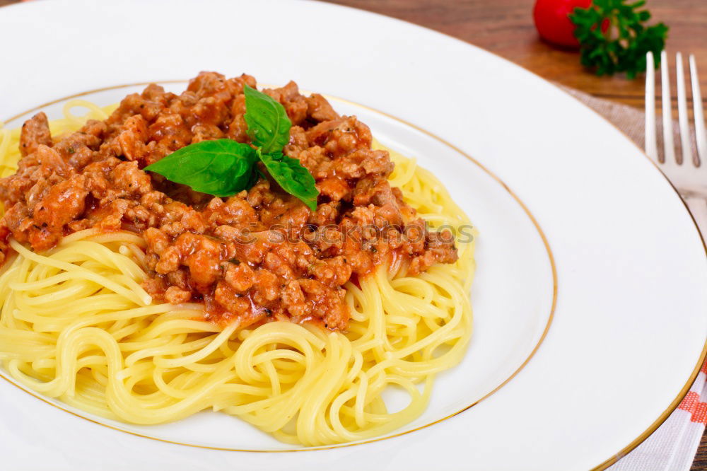 Similar – Spaghetti Bolognese in plate with fork