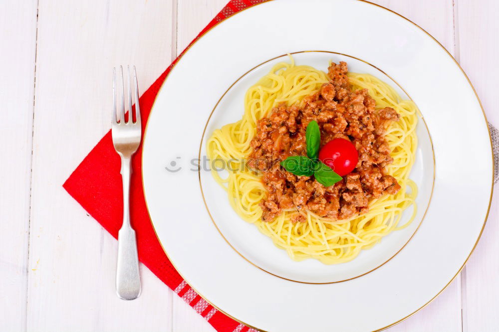 Similar – Spaghetti Bolognese in plate with fork