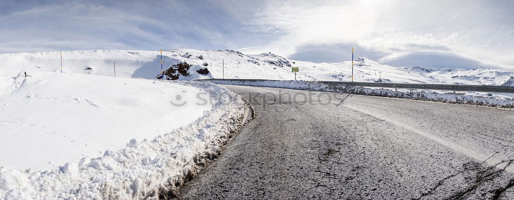 Similar – Image, Stock Photo Cyclist goes downhill along a mountain road in a snowy landscape