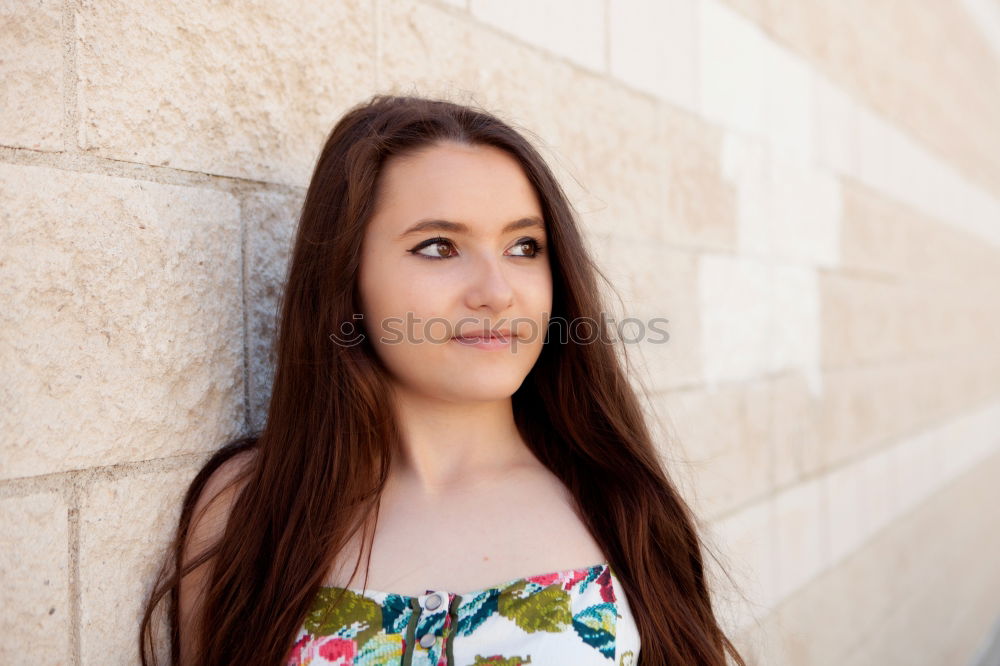 Similar – Outdoors portrait of young girl on concrete stairs looking at camera.