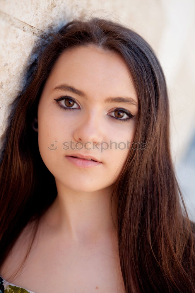 Similar – Portrait of a young teenager girl standing looking throughout the window