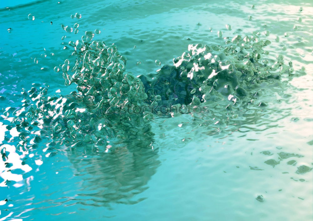 Similar – Rainwater on a blue garden table with reflection