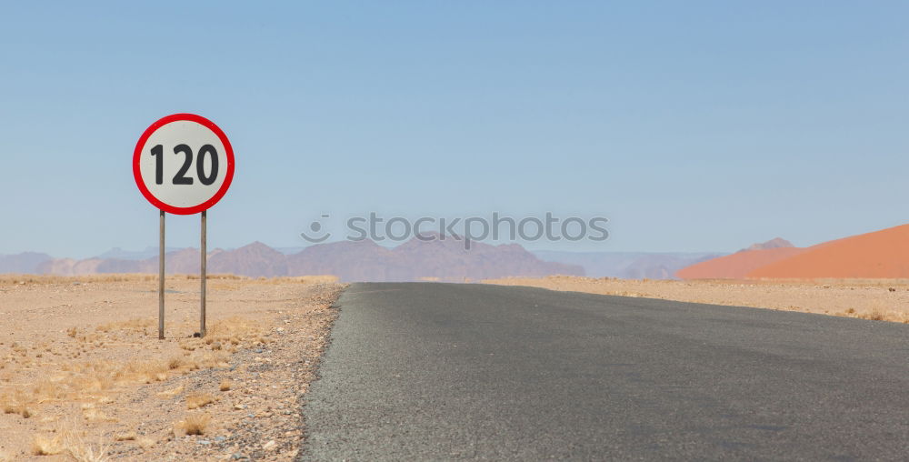 Similar – Warning sign in curve in front of alpine panorama