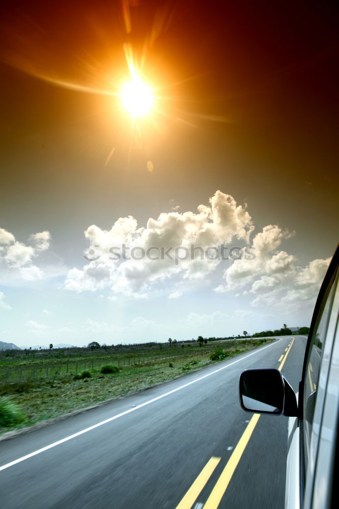 Similar – Image, Stock Photo Sunny car ride. View through the windshield onto the highway. Eyes and glasses of the driver as reflection in the rear view mirror.