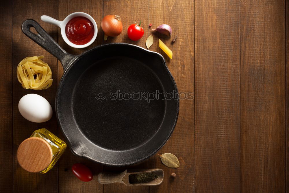 Similar – empty round black frying pan, top view