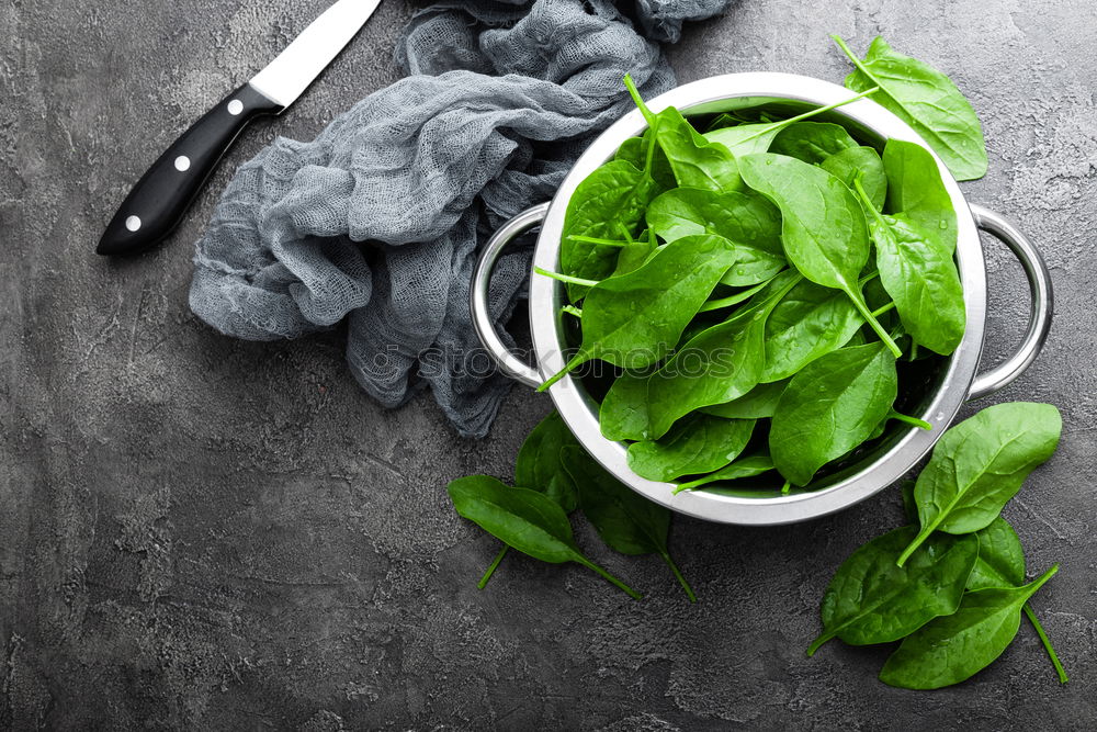 Similar – spinach in a round cast-iron frying pan