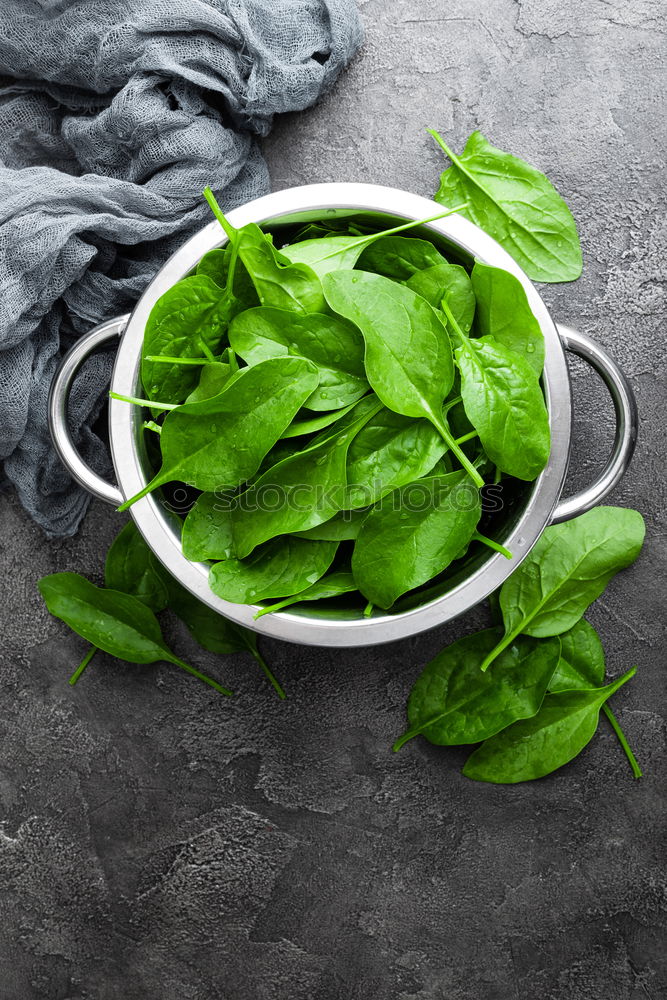 Similar – spinach in a round cast-iron frying pan