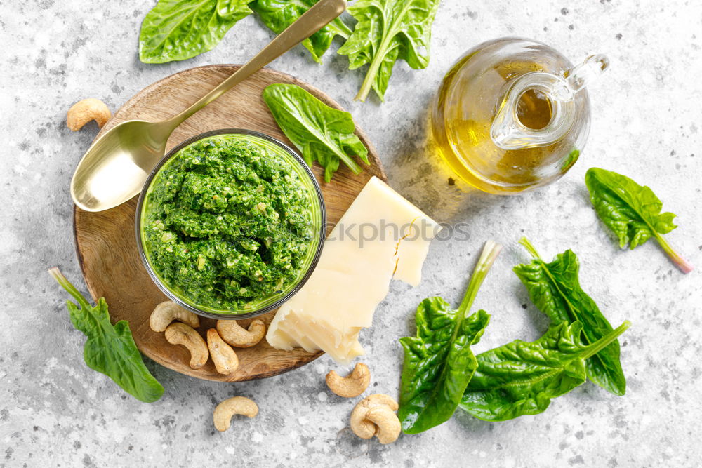 Similar – Green kale pesto in glass on dark rustic kitchen table background with ingredients, top view. Kale preparation. Healthy detox vegetables . Clean eating and dieting concept.