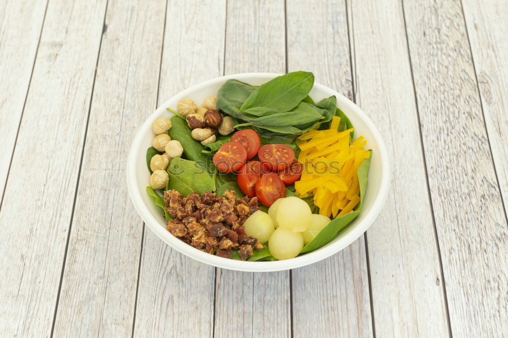 Similar – Vegan Buddha bowl with fresh raw vegetables and quinoa on wood