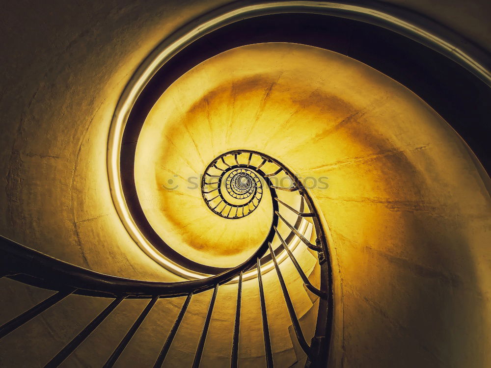 Similar – Top view of a spiral staircase in an old building