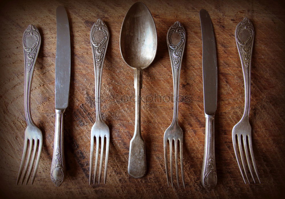 Similar – Image, Stock Photo Wooden background with vintage spoons and forks