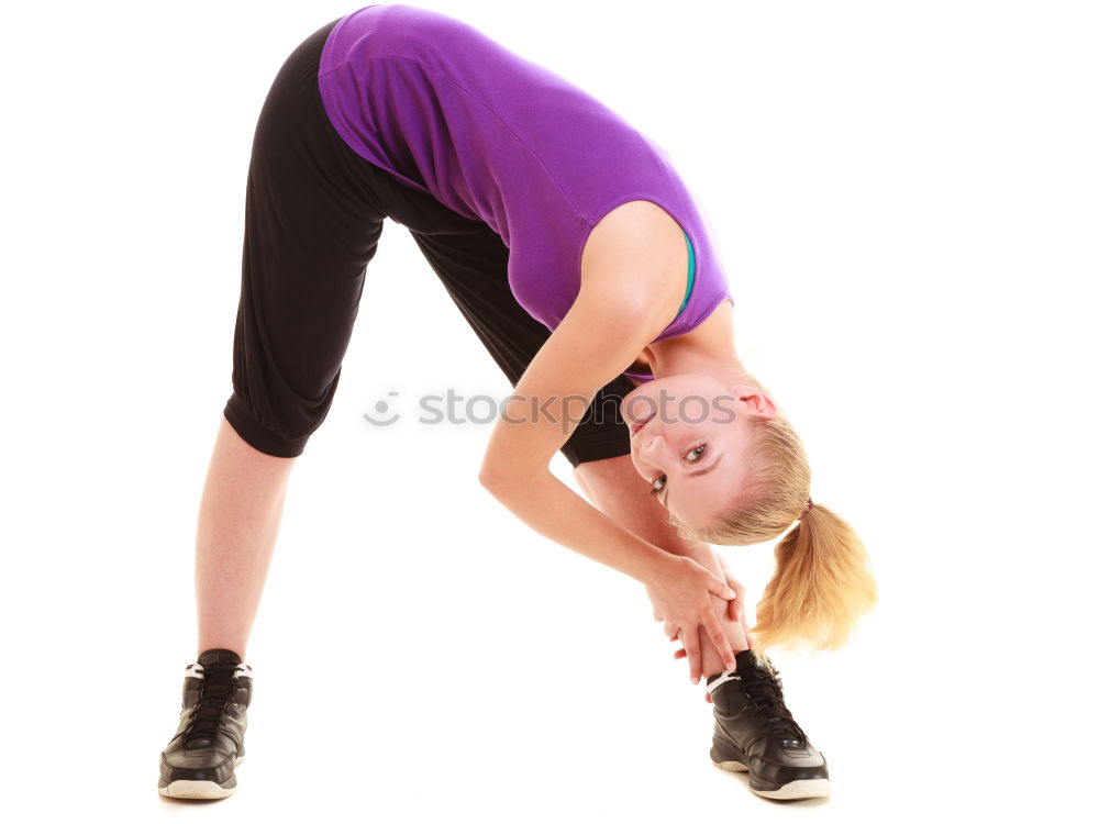 Similar – Woman stretching her body in front of ancient wall in park