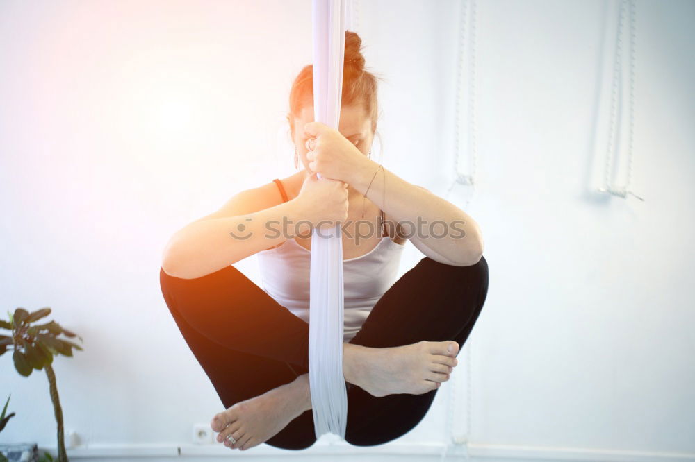 Similar – Image, Stock Photo Young woman doing pull ups in gym