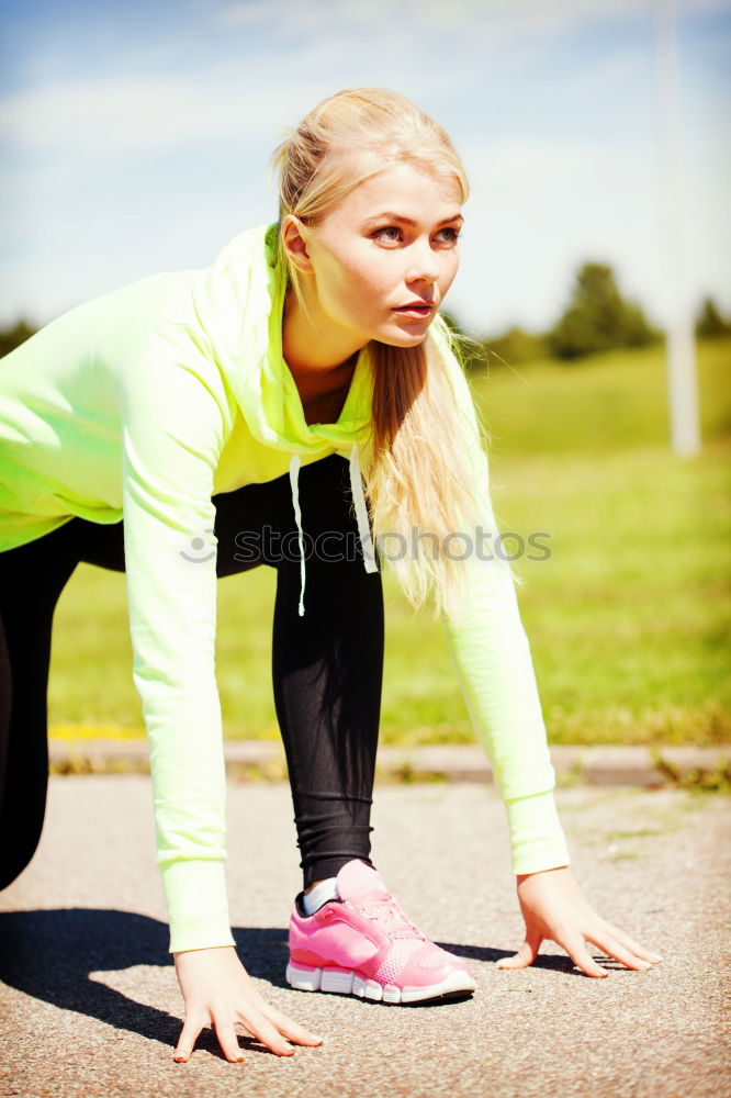 Similar – Athletic young woman doing push up exercises