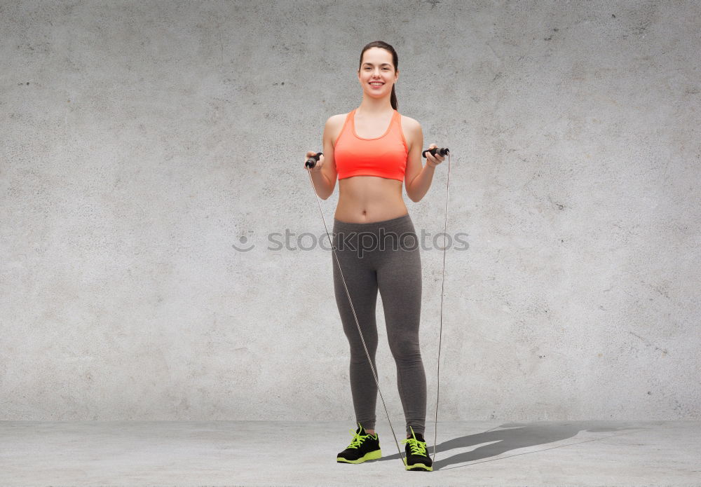 Similar – Young sporty woman doing exercises with a latex band