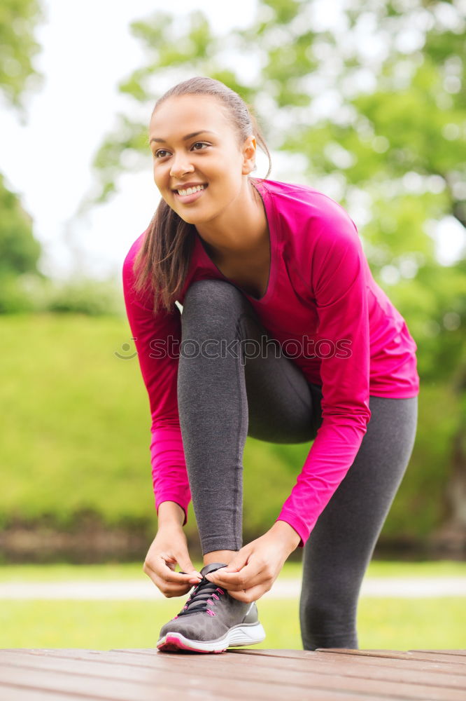 Similar – Image, Stock Photo Sporty young woman tieing her laces