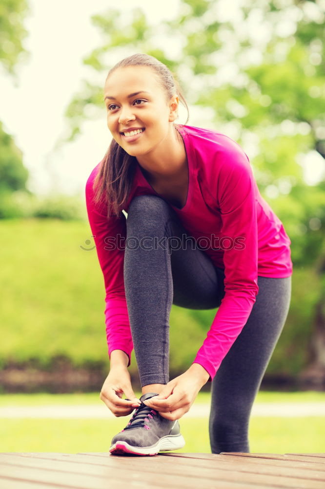 Similar – Image, Stock Photo Sporty young woman tieing her laces