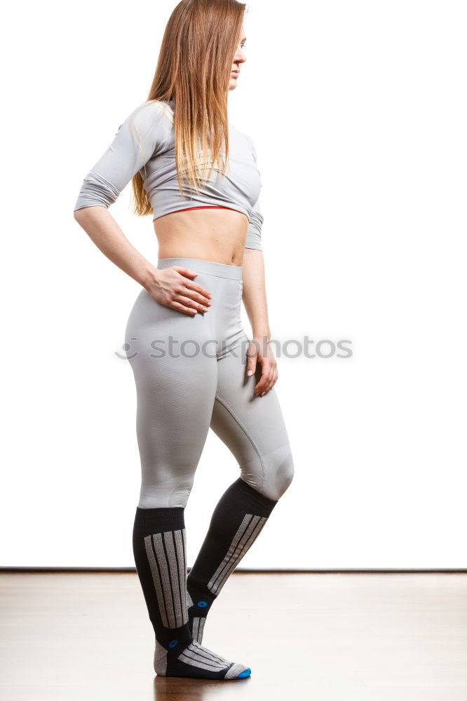 Similar – Image, Stock Photo Young sporty woman doing exercises with a latex band
