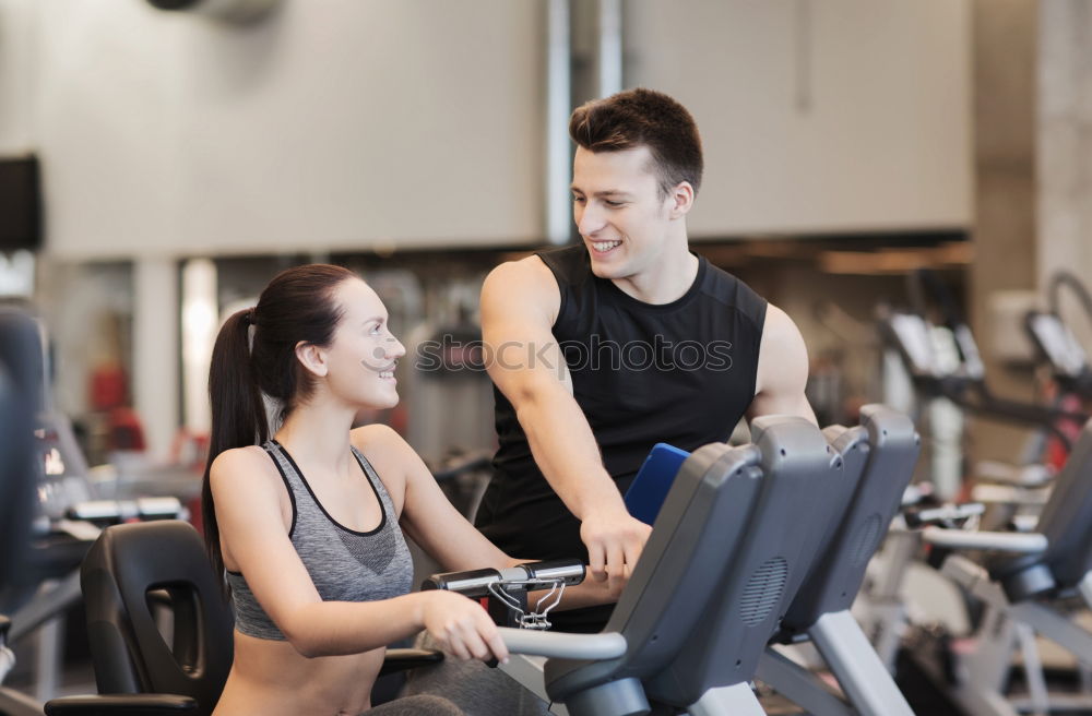 Similar – Image, Stock Photo Two people biking in the gym, exercising legs doing cardio workout cycling bikes