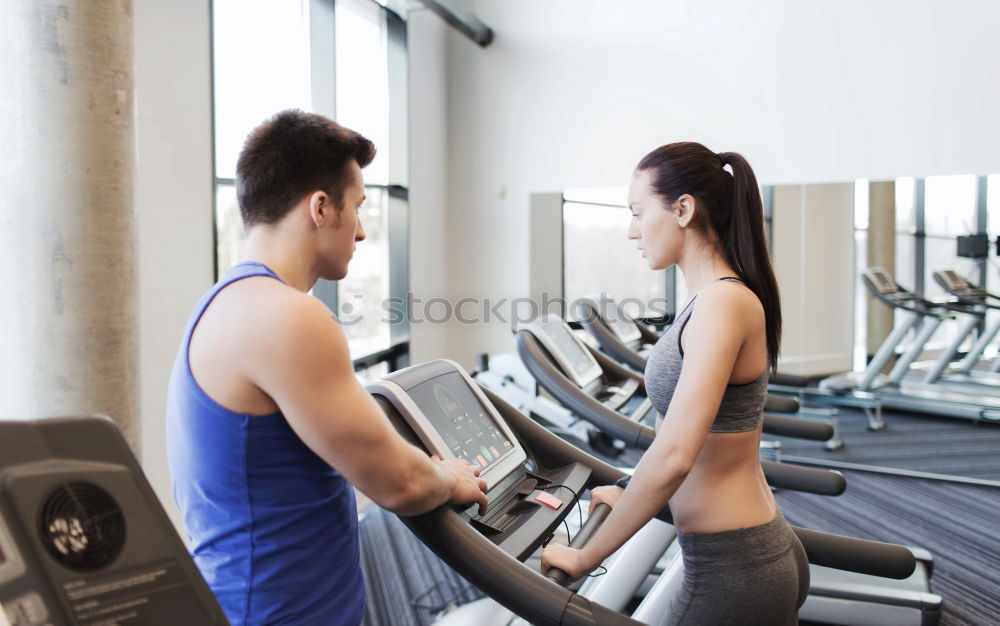 Similar – Female personal trainer helping a young man lift weights