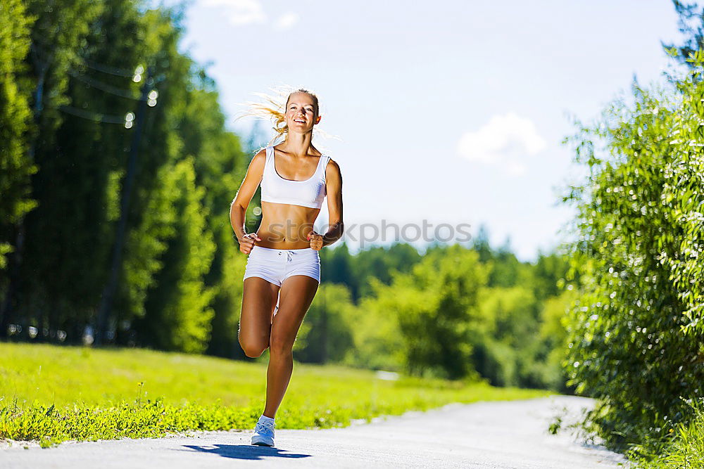 Similar – Young sporty woman jogging