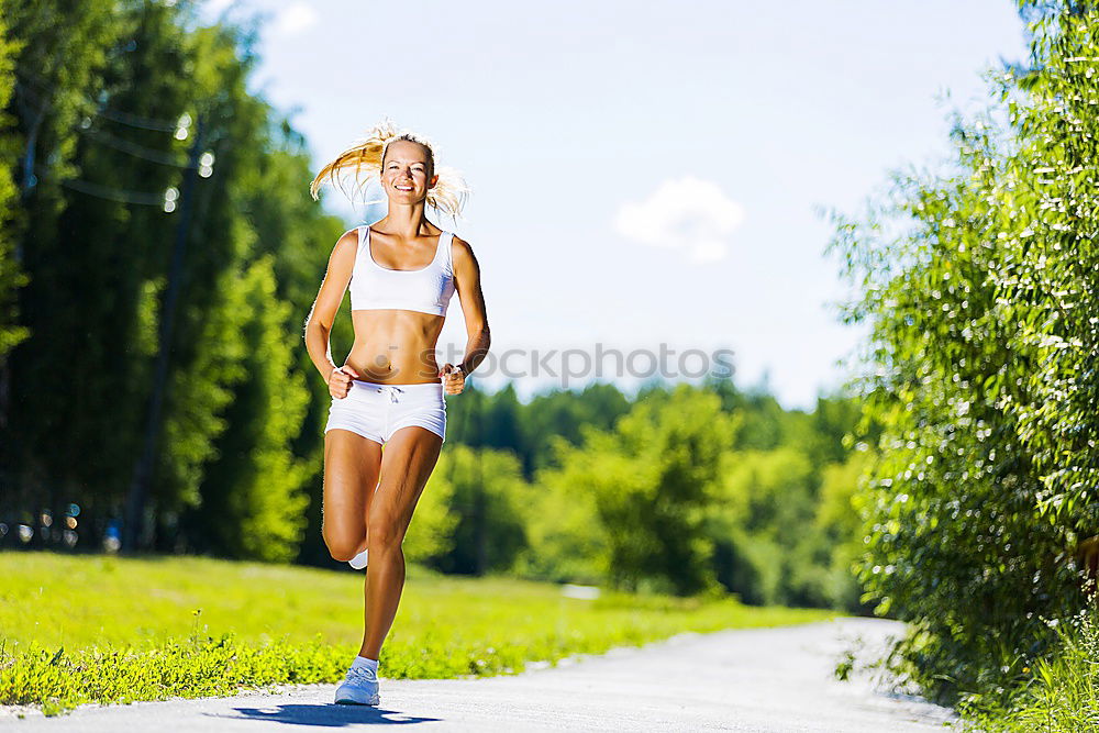 Similar – Young sporty woman jogging