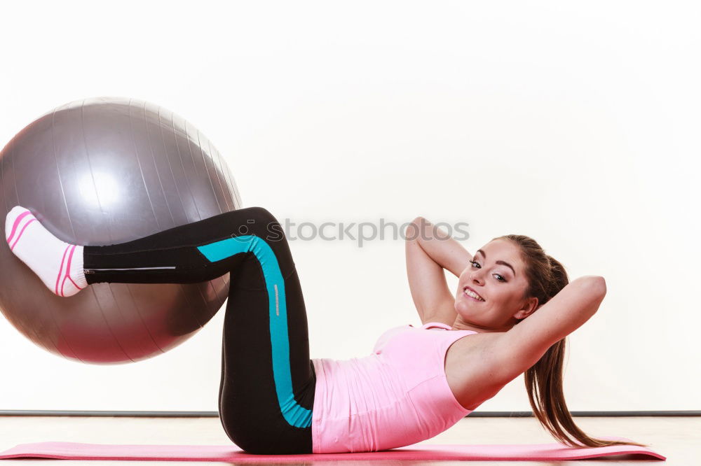 Similar – Image, Stock Photo Young sporty woman doing exercises with a latex band