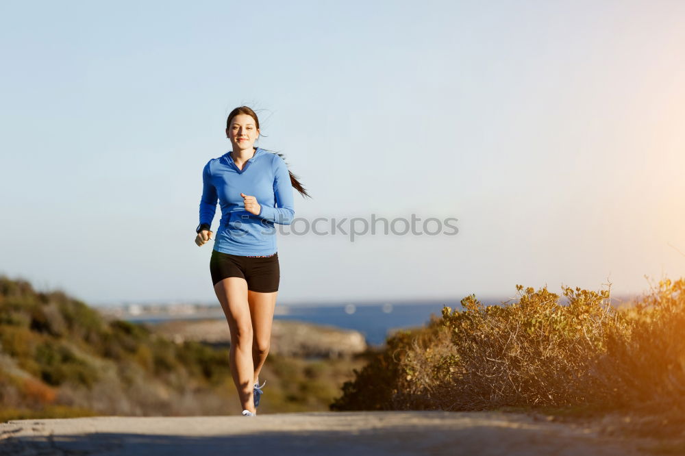 Similar – Image, Stock Photo Young sporty woman jogging