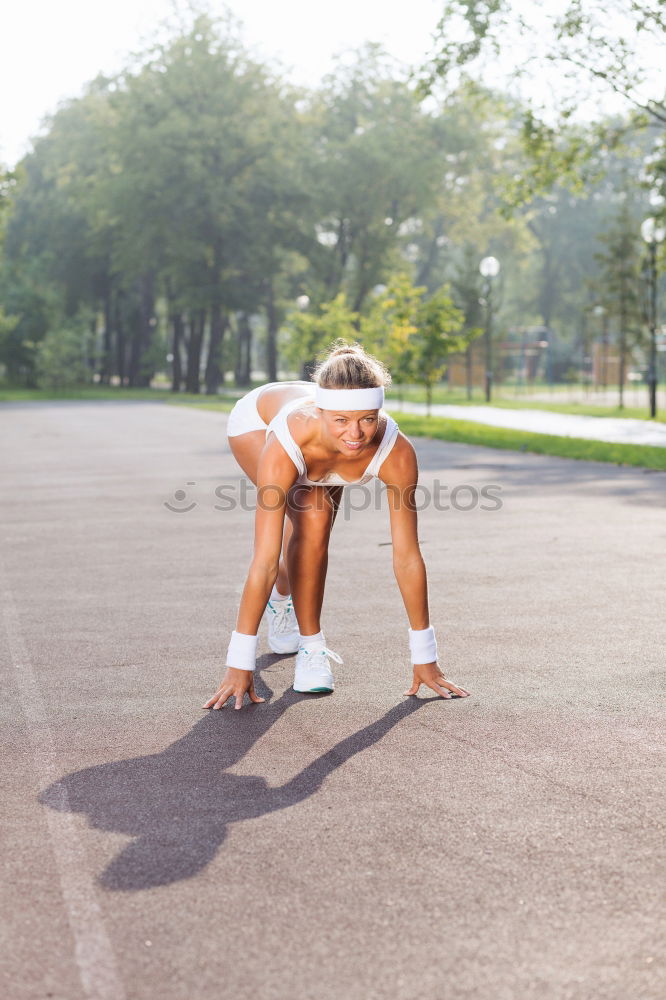 Similar – Sporty man sitting with towel and water bottle in gym floor