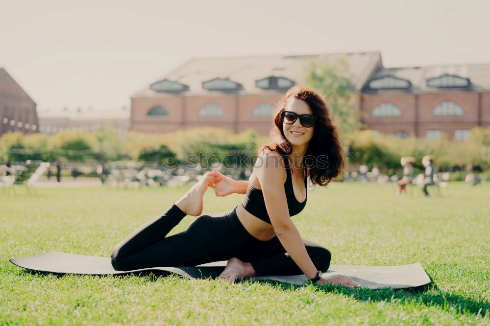 Similar – Image, Stock Photo Happy fit young woman does stretching workout on fitness mat practices yoga outside dressed in activewear has strong body breathes fresh air outdoor leads active lifestyle. Sport fitness concept