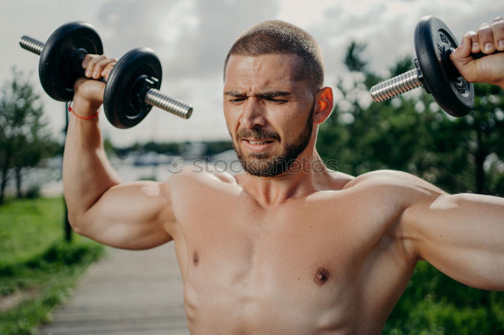 Similar – Image, Stock Photo Man stretching and woman doing dumbbells exercises in gym