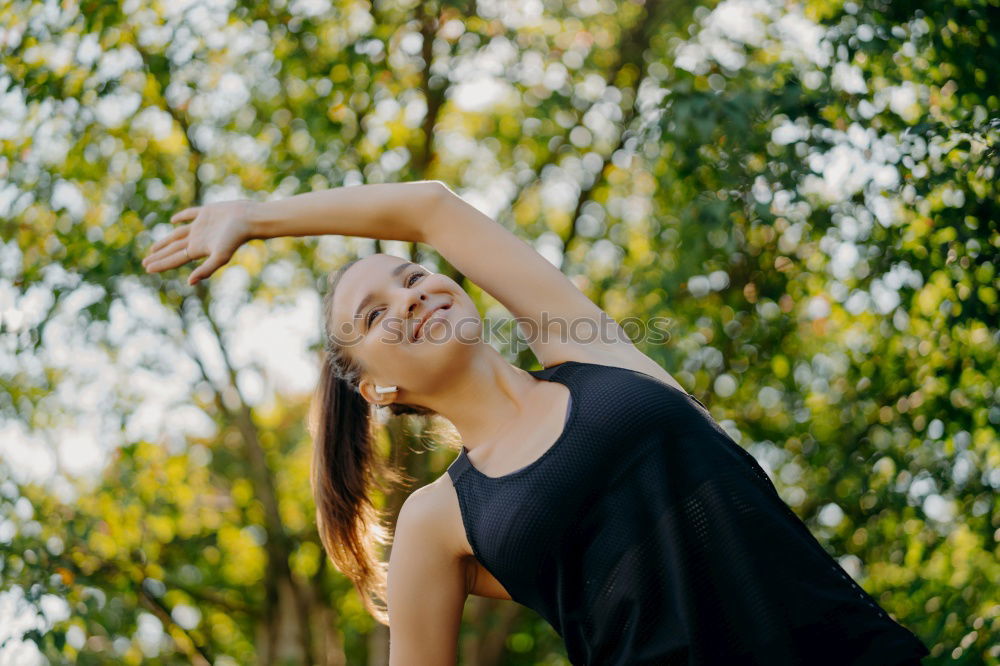 Similar – Young woman leaning on bridge railing