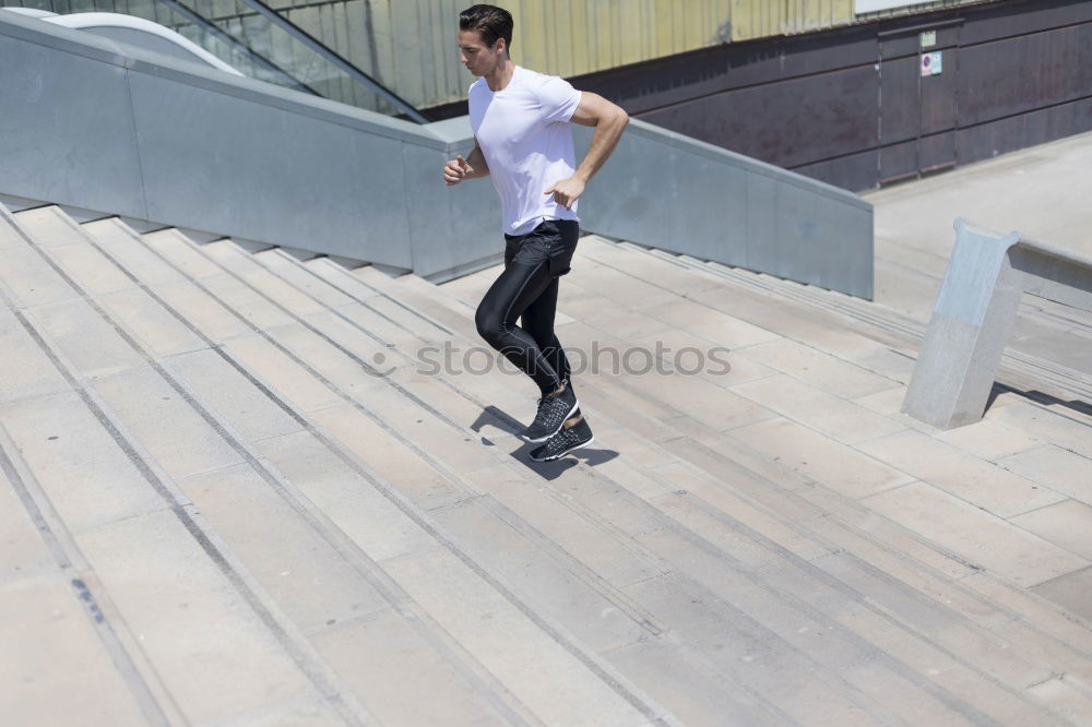 Muscular man working out in the city