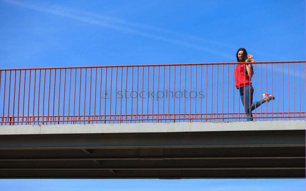 Similar – Young fitness woman runner running on city bridge.