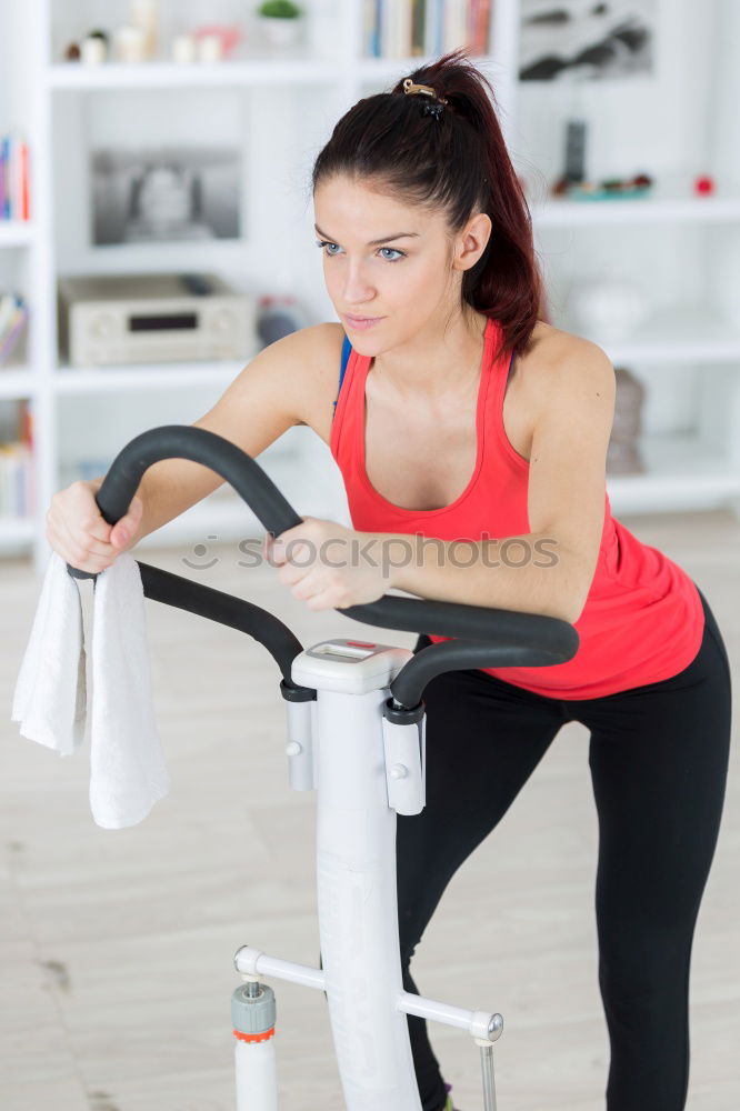 Similar – Young fit woman at the gym doing abs workout