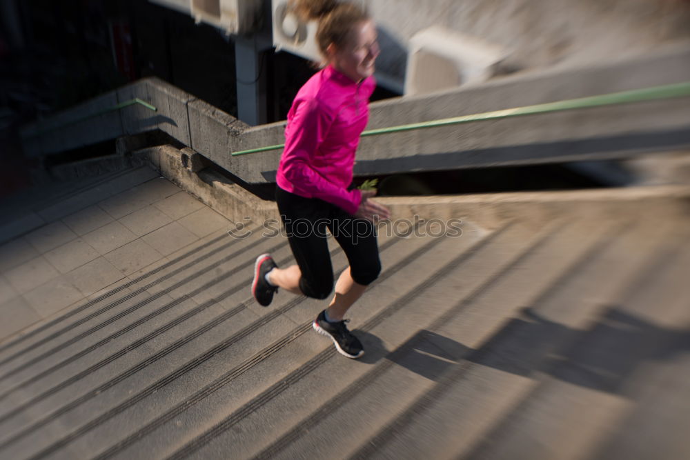 Similar – Young fitness woman runner running on city bridge.