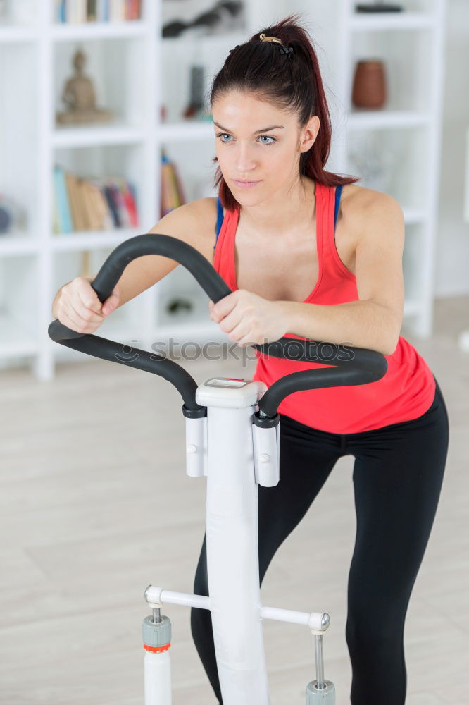 Similar – Young fit woman at the gym doing abs workout