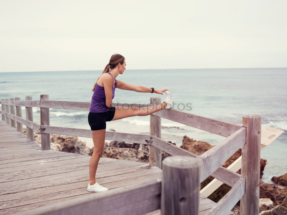 Similar – Adult fitness couple doing exercise together on beach