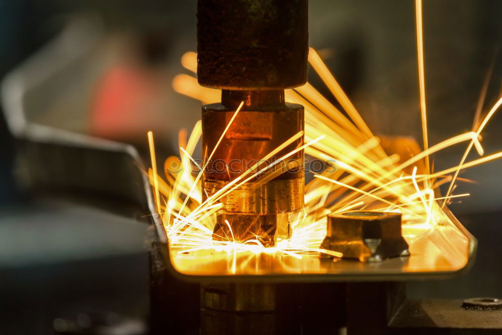 Similar – worker using an angle grinder