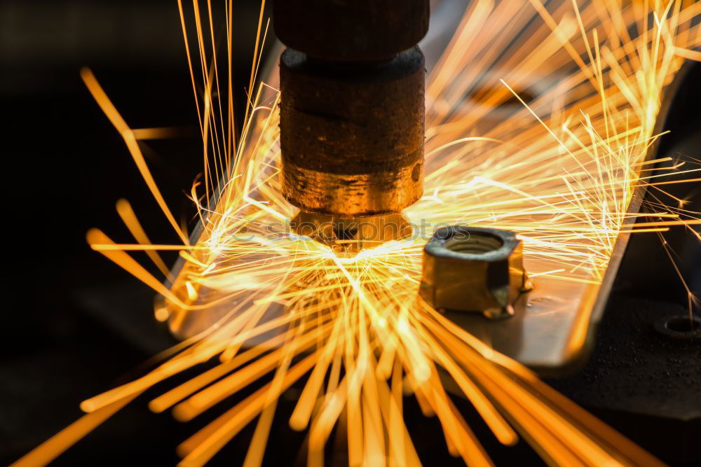 Similar – worker using an angle grinder